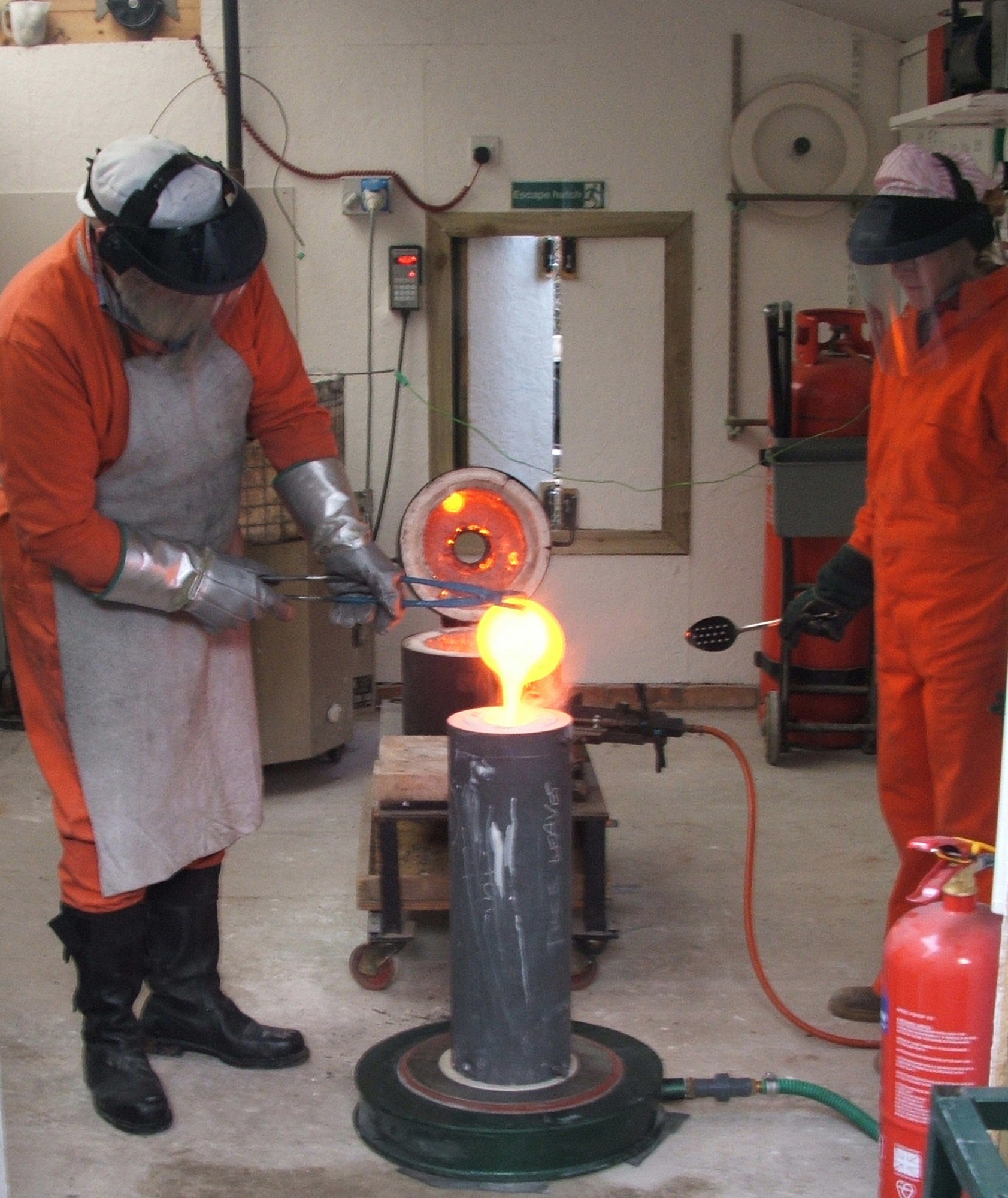 Pete pouring molten bronze