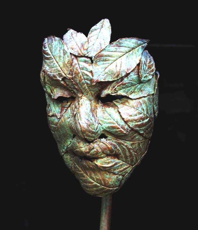 There is a sense of Peter Pan about this little mask...   (Click to enlarge)